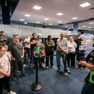 Anticipation builds as players listen intently to their mission brief at Tactical Urban Combat - it's game time