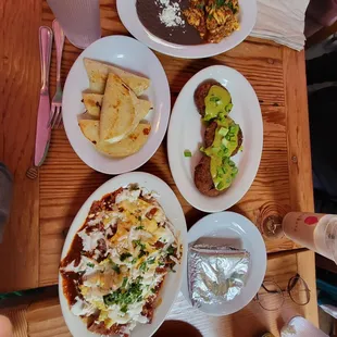 Egg and chorizo (top), potatoes with the green sauce, cheese quesadilla (left), and nacho-ish with egg and mole-ish sauce. All delish!