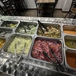 condiment station with limes, salsa, etc.
