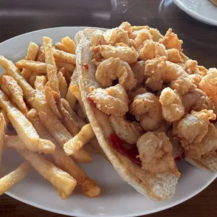 Over stuffed fried shrimp Poboy and fries