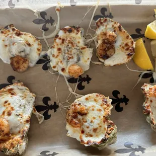 Chargrilled oysters.. Parmesan and mozzarella cheese, a grilled shrimp and bacon.