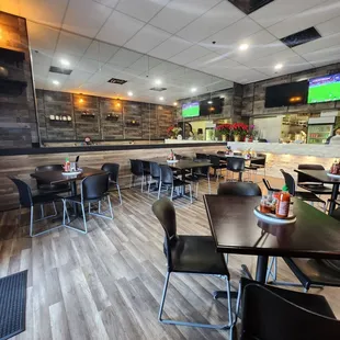 a restaurant with tables and chairs