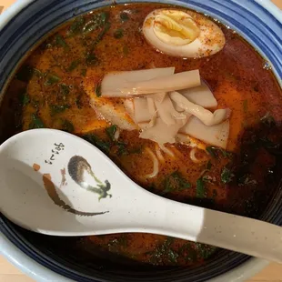 a bowl of soup and a spoon