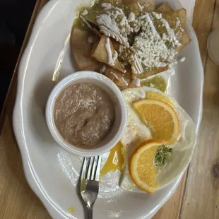 Chilaquiles beans and over med eggs