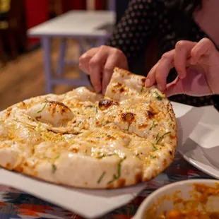 Garlic Naan. Cut into four slices.
