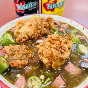  bowl of soup with fried chicken and vegetables