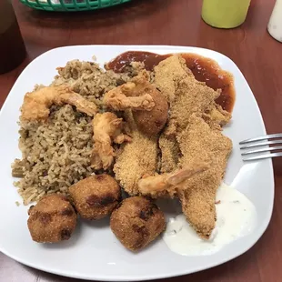 Catfish, hush puppies, shrimp and cajun rice