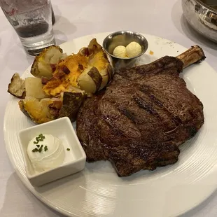 Bone in ribeye medium rare. Loaded baked potato