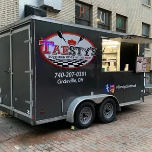 a food truck parked in front of a building