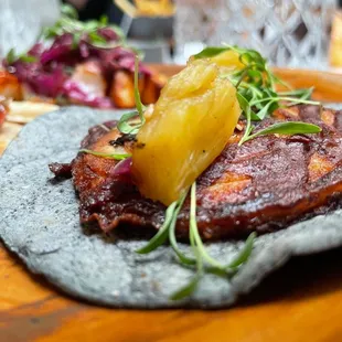 a plate of food on a wooden table