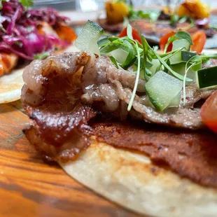 a plate of food on a wooden table