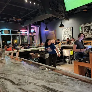 a group of people at a bar