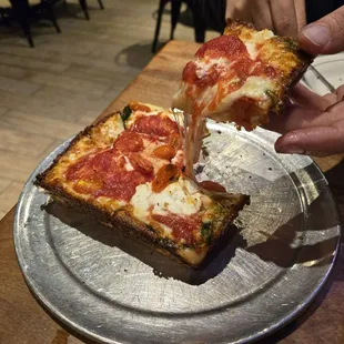 Look at that epic cheese pull!