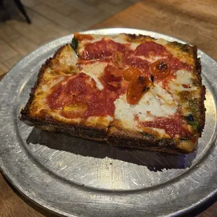 Detroit style,  small spinach and ricotta pizza with cherry tomatoes added... very good!