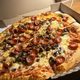 One of their specialty pizzas with green pepper, black olive, mushroom, pepperoni, and sausage. Absolutely delicious.