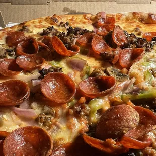 One of their specialty pizzas with green pepper, black olive, mushroom, pepperoni, and sausage. Absolutely delicious.