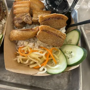 Pork belly aka lechon kawali on a bed of garlic rice pickled vegetables aka attchara!