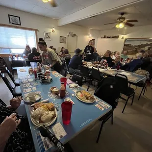 a group of people sitting at a table