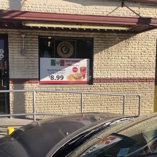 a car parked in front of the store