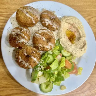 Falafel plate with rice, salad and hummus
