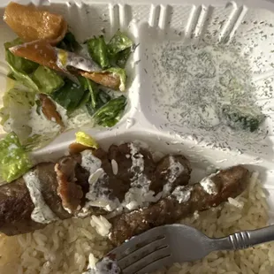 Gyro plate with rice, salad, and tzatziki