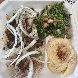 Chicken kebab, hummus and toubuli served over rice