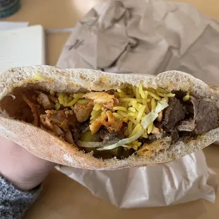 Custom pita with chicken, beef, rice, lettuce, and bbq tahini sauce