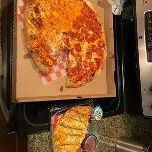 Pizza and garlic bread from pizza shop