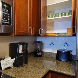 Serving ware, coffee maker, blender, toaster provided.