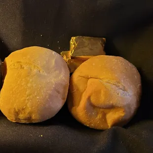 two rolls of bread with butter