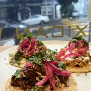 Chicken taco, carnitas tacos. I don't like onions, but these pickled onions were amazing.