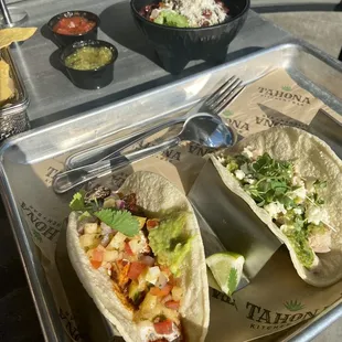 Chicken taco &amp; blackened mahi (spicyish) taco of the day with side of beans.