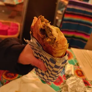 Falafel wrap with added feta cheese.