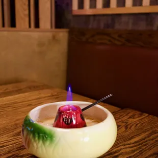 a drink in a bowl on a table