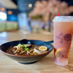 a bowl of ramen and a drink