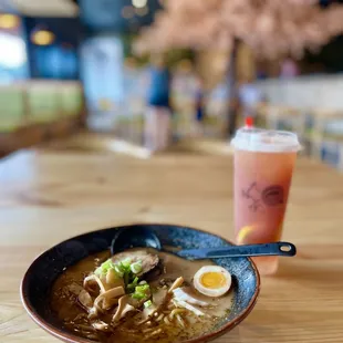a bowl of ramen and a drink