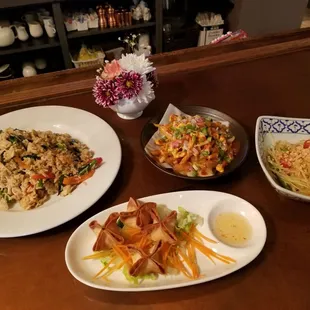 Thai fries, crab rangoon, papaya salad and chicken fried rice.