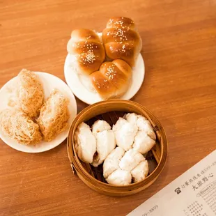From left to clockwise: taro gok (or taro puff), hot dog buns &amp; char siu (or pork) buns (also known locally as manapua)