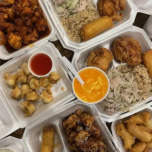 a variety of asian food in plastic containers
