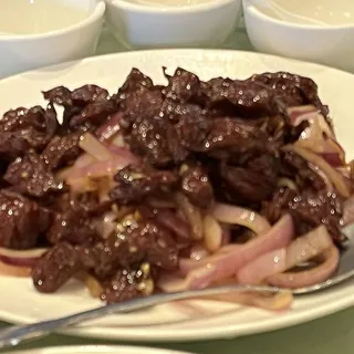 Beef Steak with Black Pepper Sauce on Plate