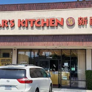 a car parked in front of a restaurant