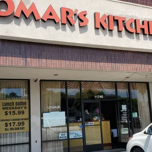 a car parked in front of a restaurant