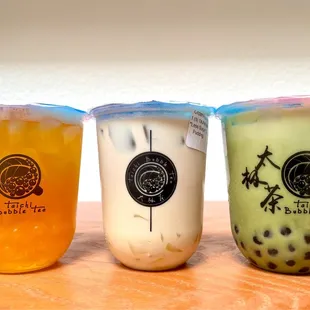 Passion fruit tea w/ passion fruit (popping) boba, original Taichi milk tea w/ egg pudding, and matcha milk tea w/ boba