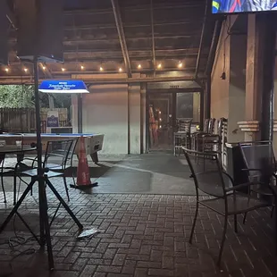 tables and chairs in a patio area