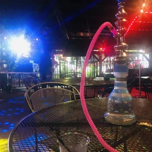 Outdoor patio with DJ and hookah