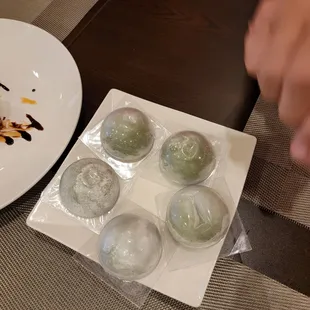 a plate of food and a plate of ice cream