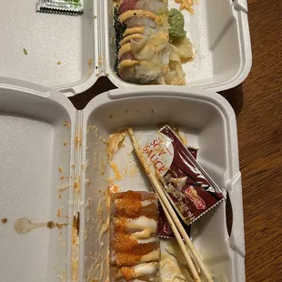 two trays of food with chopsticks