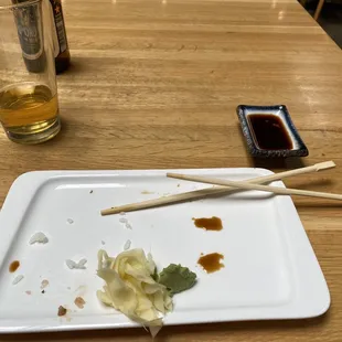 chopsticks and sauce on a plate