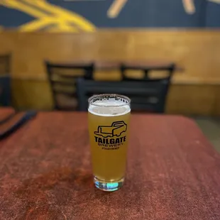 a glass of beer on a table