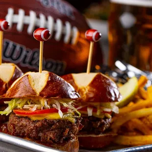 a tray of burgers and french fries